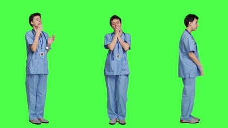 Medical-assistant-feeling-extremely-sleepy-against-greenscreen-backdrop